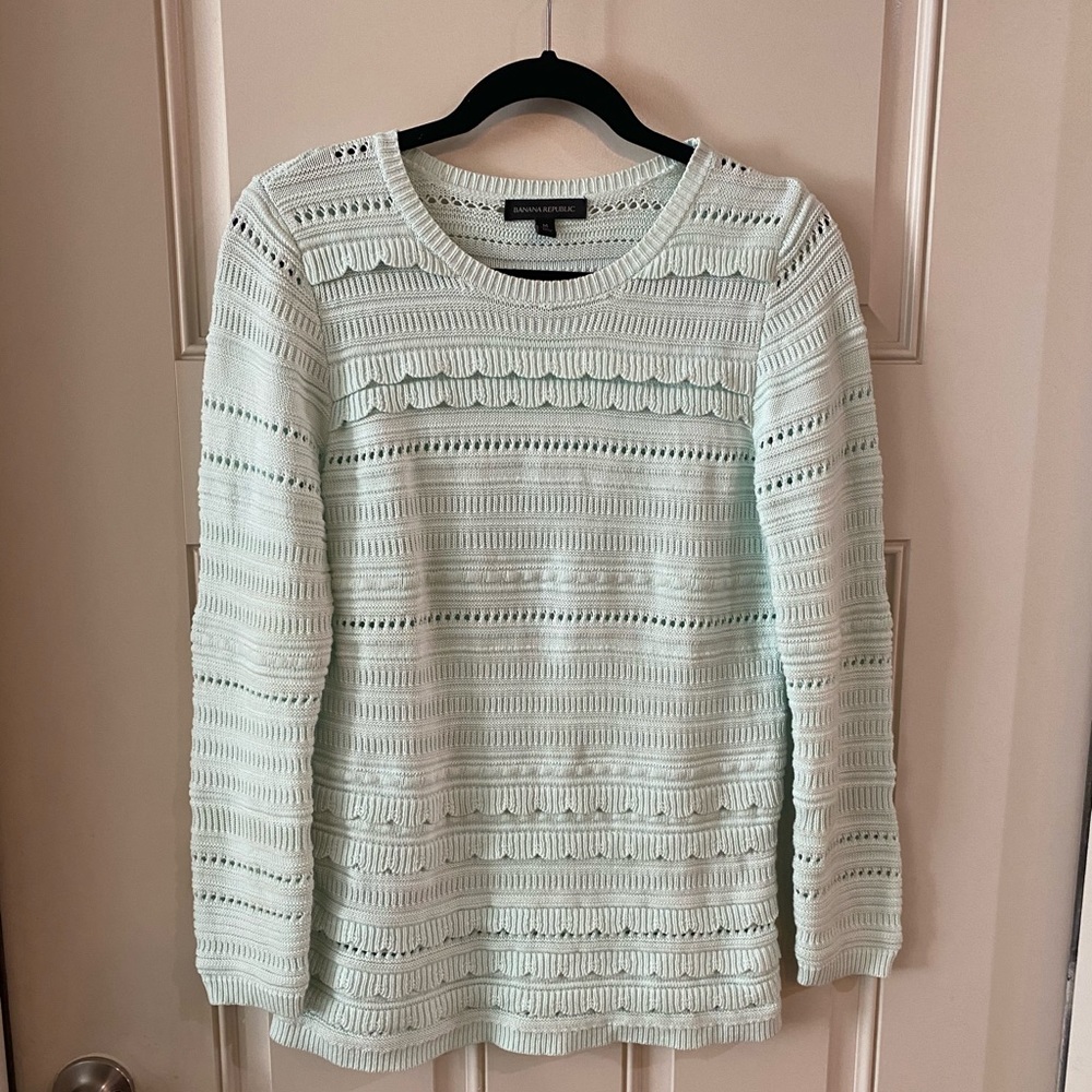 Aqua, light blue sweater.